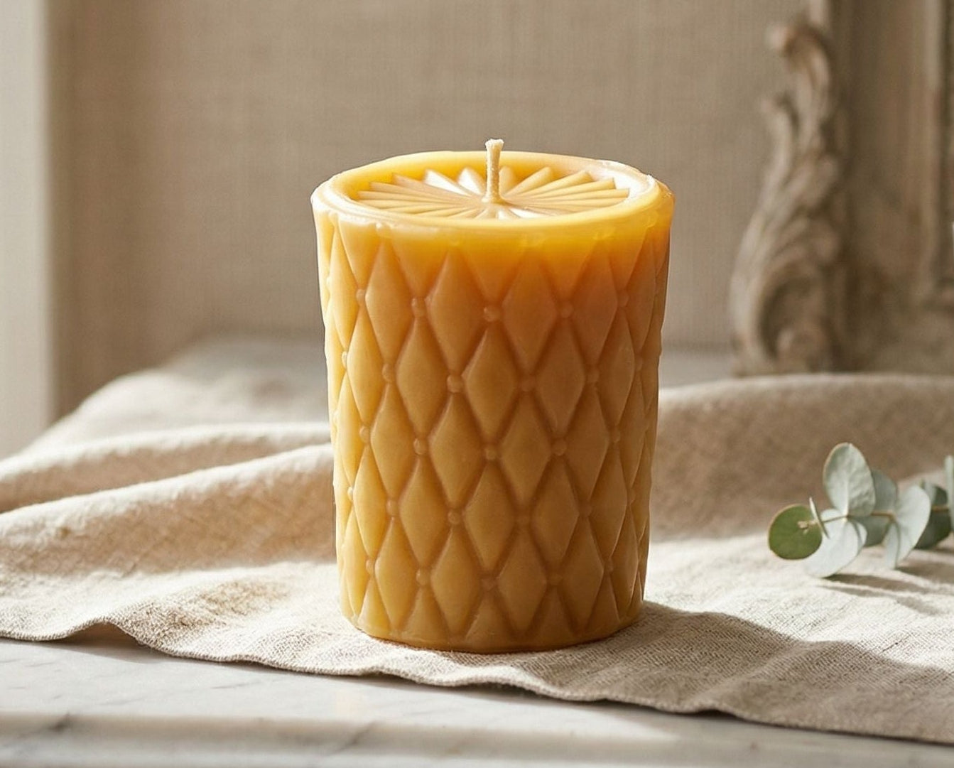 Diamond Pillar candle in natural beeswax gold with sunburst top.